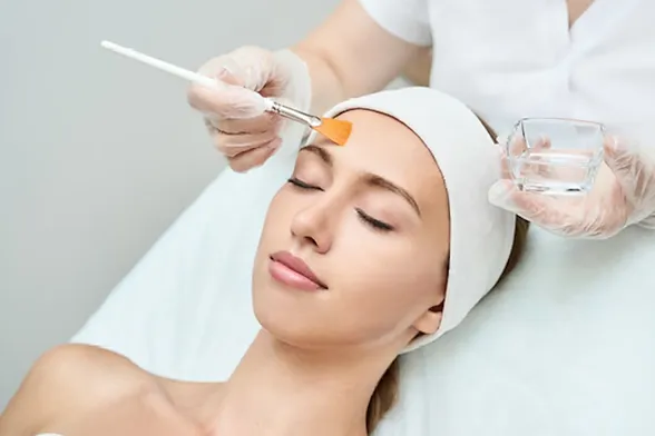 A woman getting chemical peel treatment